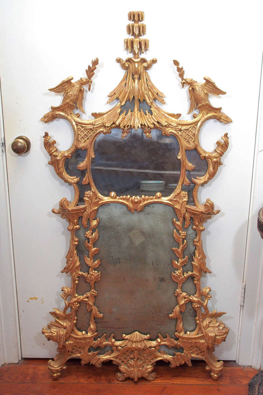 Pair of Chinese Chippendale style early 19th century mirrors with original plates and gilt finish.