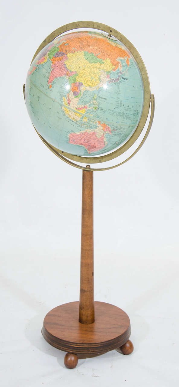 Very handsome world globe mounted on a walnut stand. The political geography indicates that it is from the 1950s. Please contact for location.