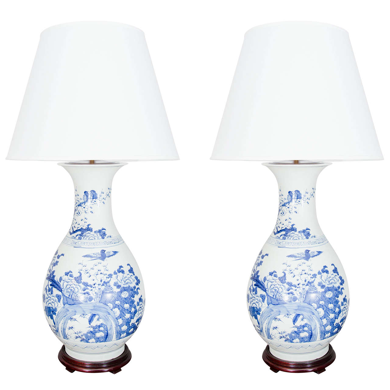 Pair of large blue and white porcelain vases wired as lamps. Shades available separately.