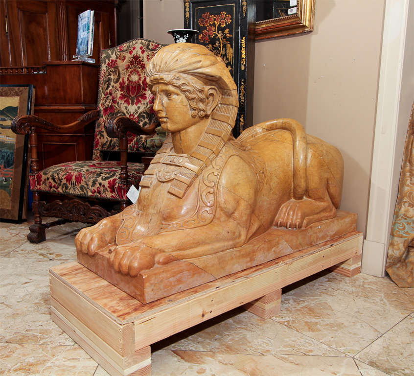 Massive red marble Sphinxes, marble is rosa valencia tone. Hand carved in 1885 (date carved on back)