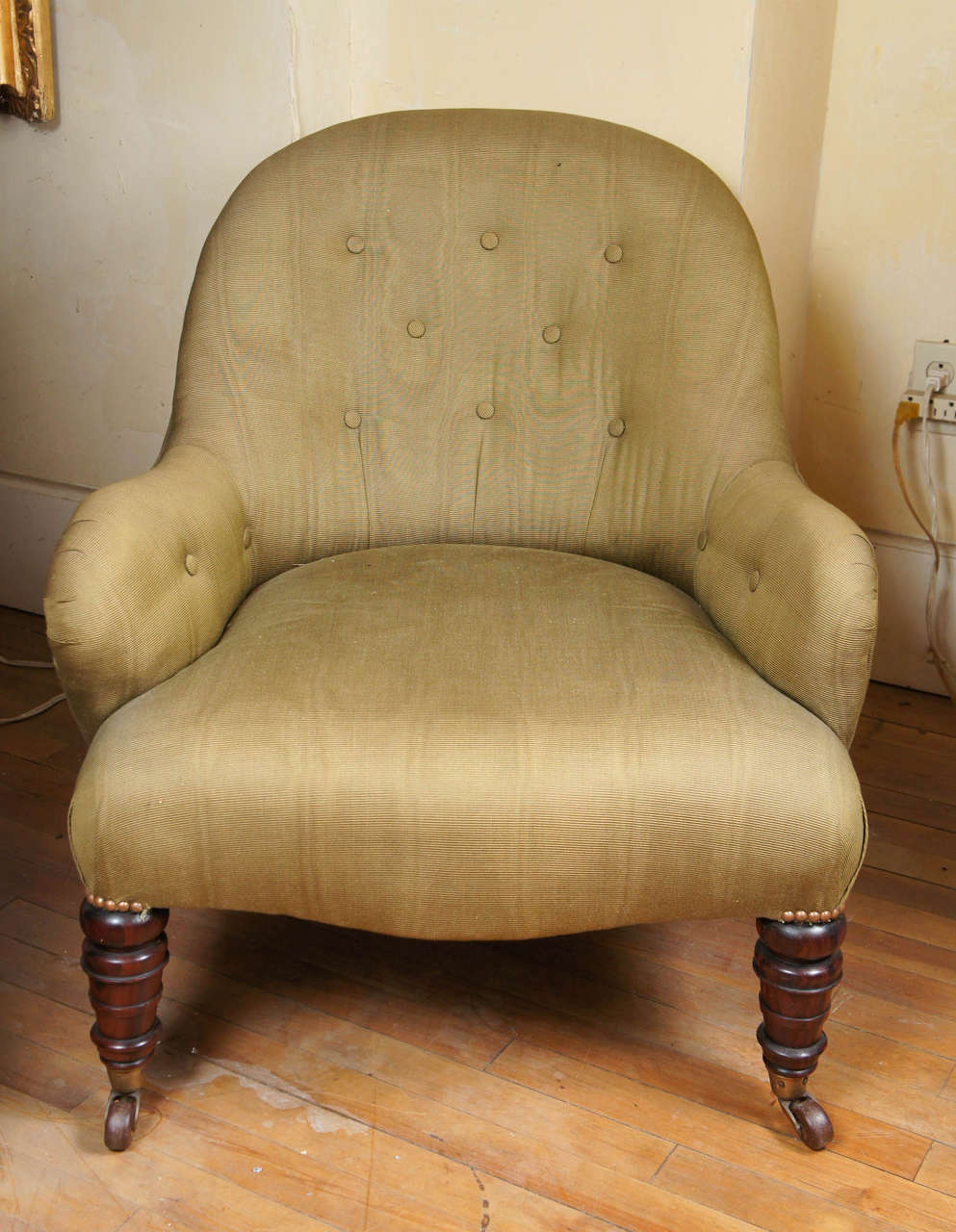 This fine comfortable chair crafted from rosewood is from the late Regency period, circa 1820. Low and well proportioned it was designed as the ideal form of seating for casual living. Rosewood a costly material from England's colonial Empire was a