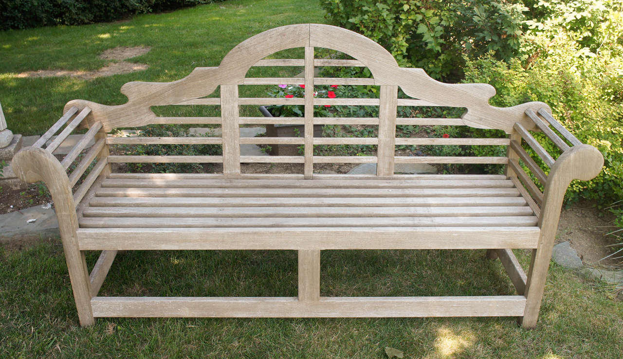 This bench, one of many items designed by the British architect Sir Edwin Lutyens, is made in the traditional wood teak in England and is constructed with dowels and pegs just the way his first pieces were completed. 
Purchased in England by the