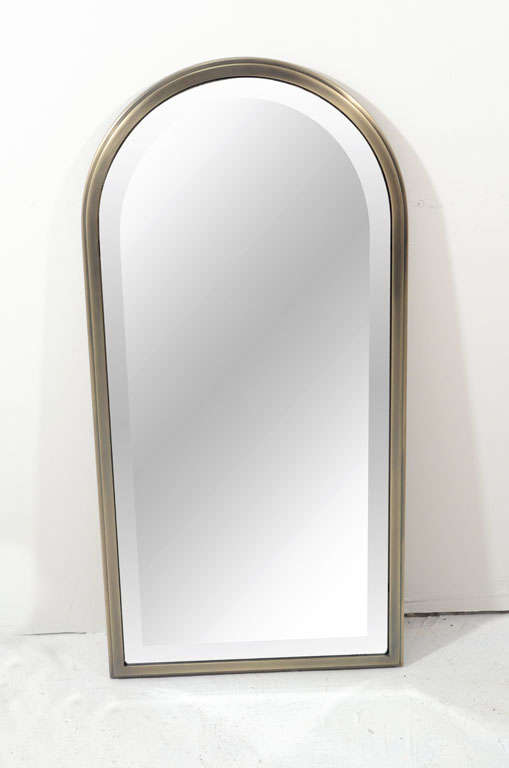 Tall and terrific mirror with beveled glass, bronze finish and simple lines. In exceptionally clean condition.