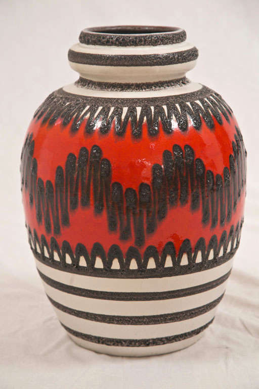Grat looking and substantial lava pot/ floor vase with orange/red and black detail. A terrific accent piece. Very large. 1960s West Germany.