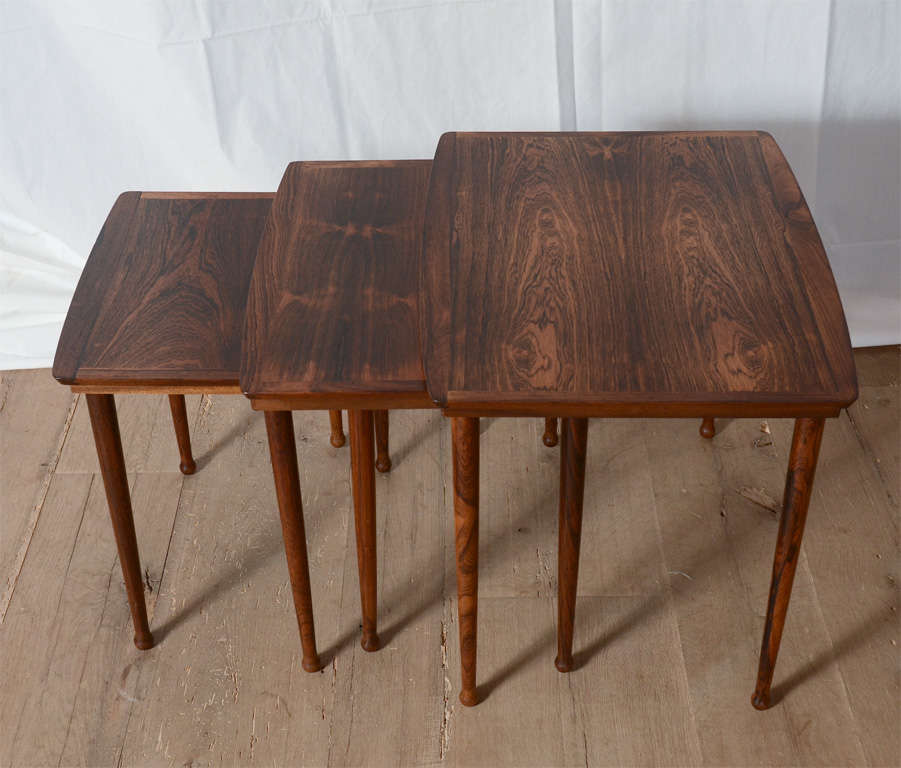 Stunning rosewood midcentury nesting tables in the matter of Knuud Joos, Denmark.