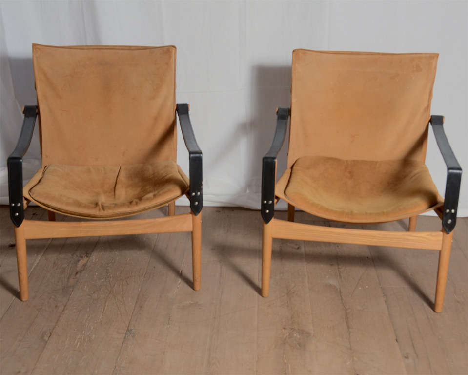 Rare pair of suede Hans Olsen 1960s Safari chairs.

Experimenting with both form and materials, Hans Olsen created his own distinctive style designing and producing a series of exciting pieces. He was a student of Kaare Klint at the Royal Danish