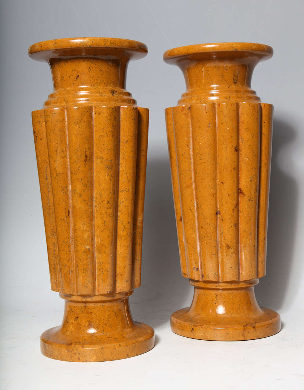 A pair of unusual antique French Art Deco carved Sienna marble vases, 1930s.