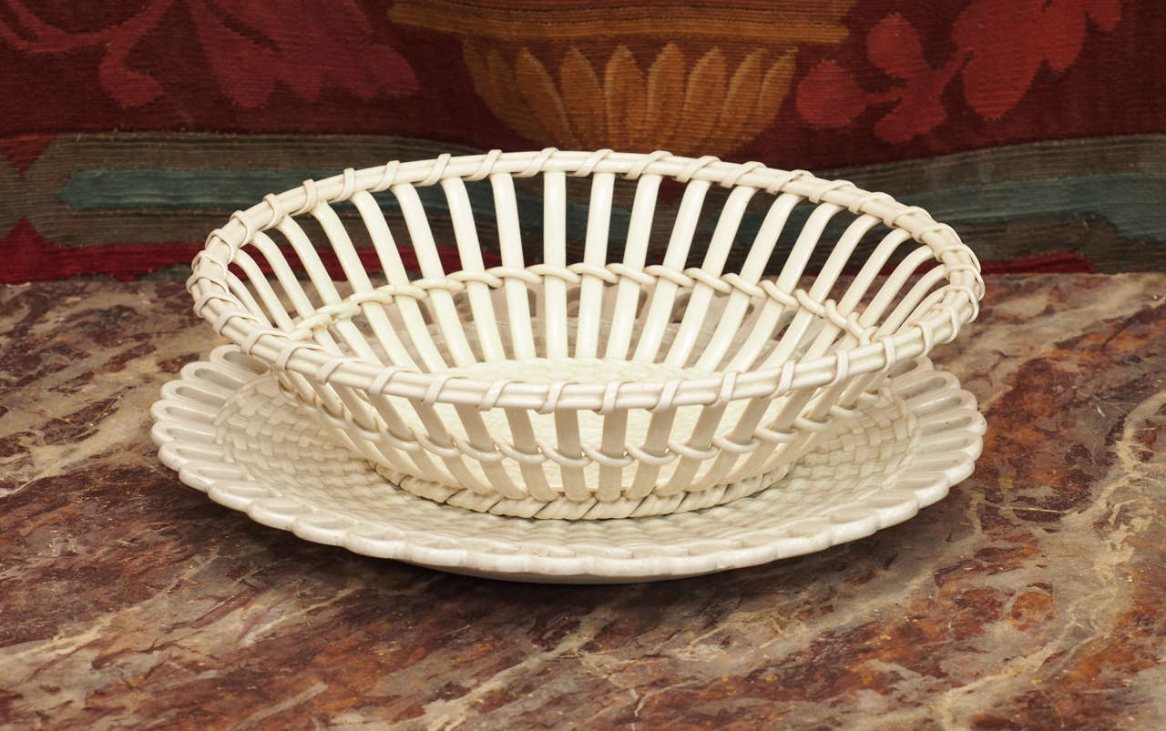 Pair of French Creil Creamware Baskets with Underplates 
Pottery woven baskets with pierced under plates for chestnuts originally