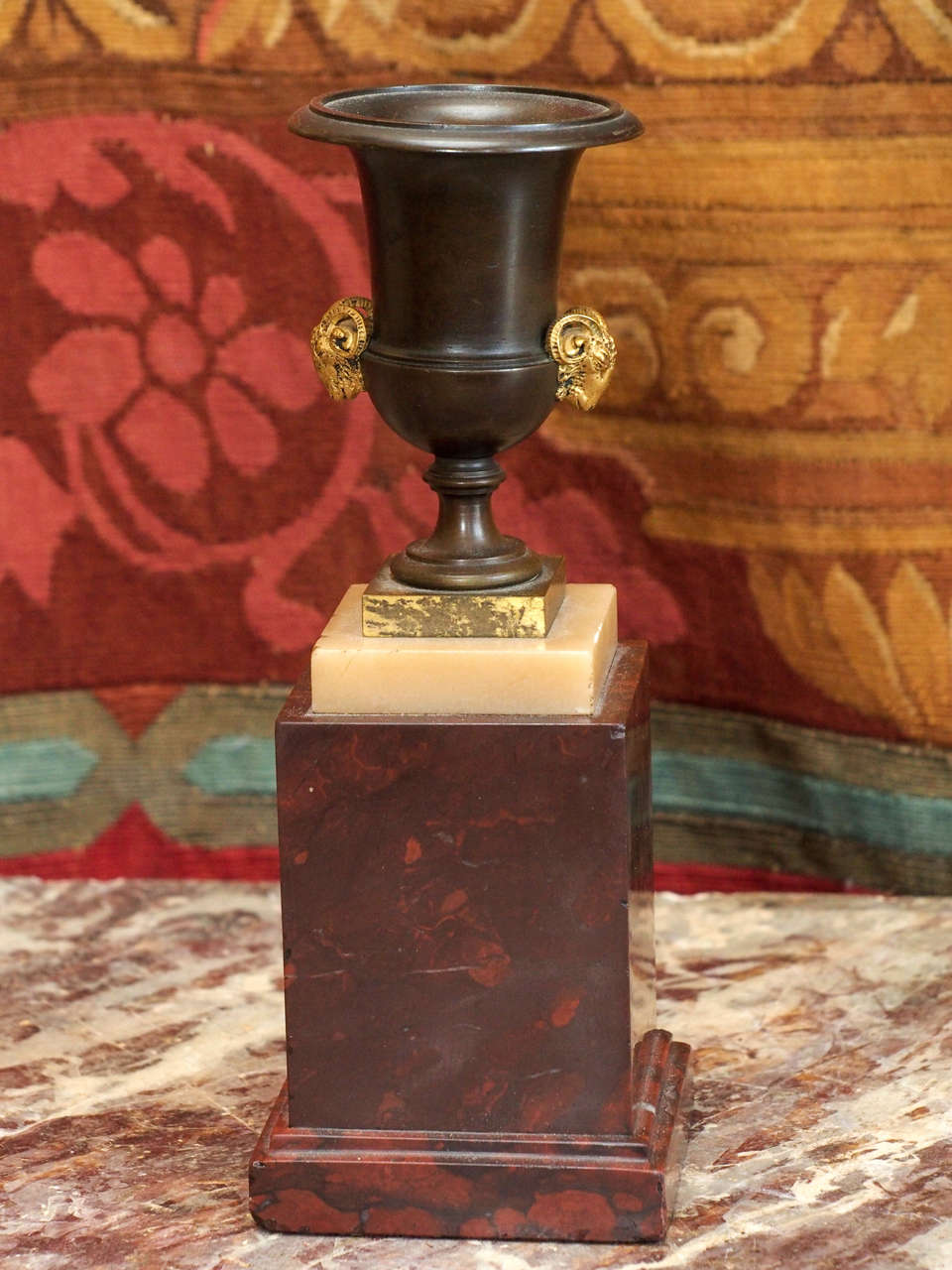 Pair of French NeoClassical Bronze Urns on Rouge Marble Bases