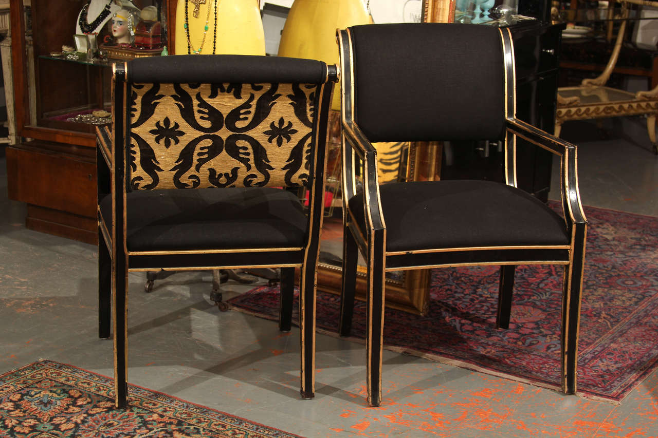 A total of six chairs are available.
Two chairs have 19th century gold and black inset in back.
Four chairs are solid black linen
Set of six is 6500.00
Can be broken up into pairs as follows:
Pair with black and gold fabric backs 2800.00 the