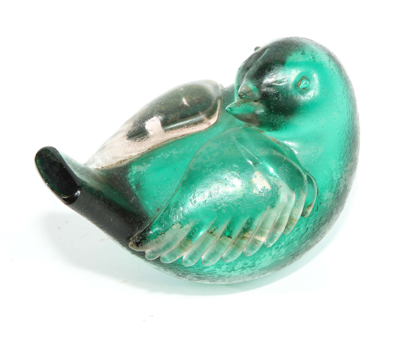 Vetro soffiato verde di Murano con superficie acidata.
Questo passero fa parte di una serie di animali disegnati da Tyra Lundgren in  negli anni '30.

Firma ad arco Venini Murano.