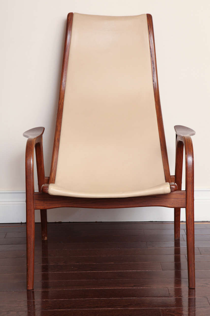 With original ivory leather upholstery. Designed in 1956 by Ekström. Stamped 