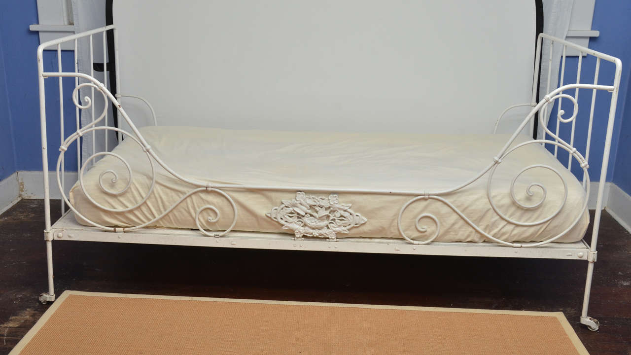 French 19th cent. Iron folding day bed with scroll design side centered by a   cast iron medallion of a bird in a nest. Great as a day bed or a childs bed. Nearly identical to item 1408159201350 -- great as a pair of beds. Mattresses were custom