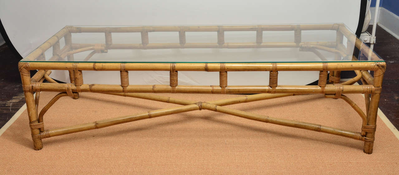 American 1960s rattan rectangular coffee table having wrapped joints and X stretcher.
