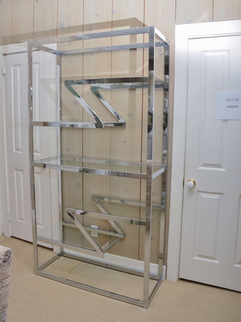 Very attractive chrome etagere with glass shelves.