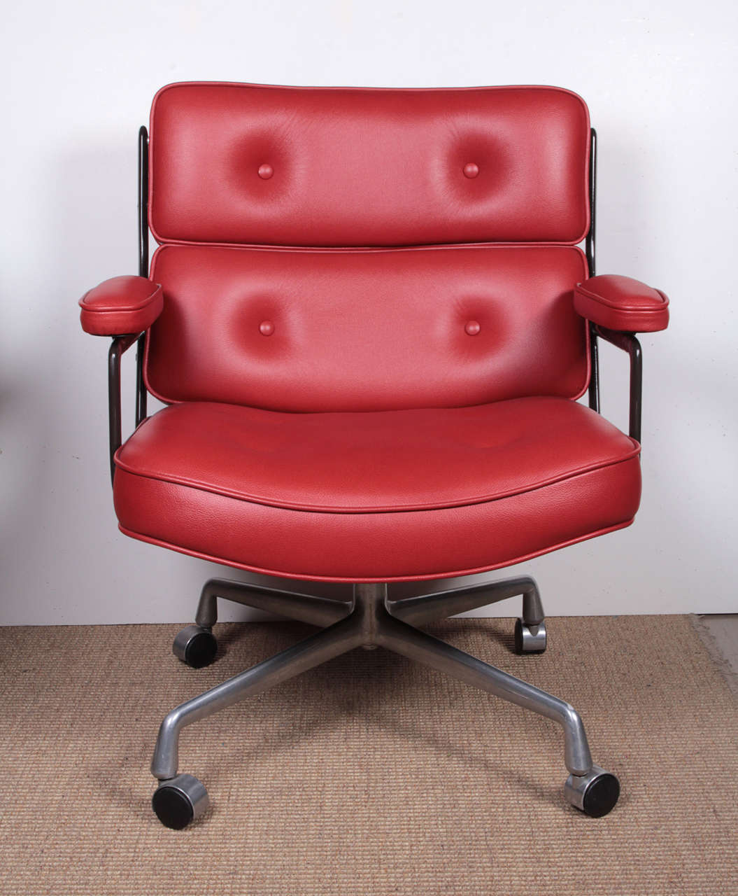 Charles Eames executive desk chair, originally designed for the Time Life building in the 1960′s. This chair has been reupholstered in ox blood colored Spinney beck leather.