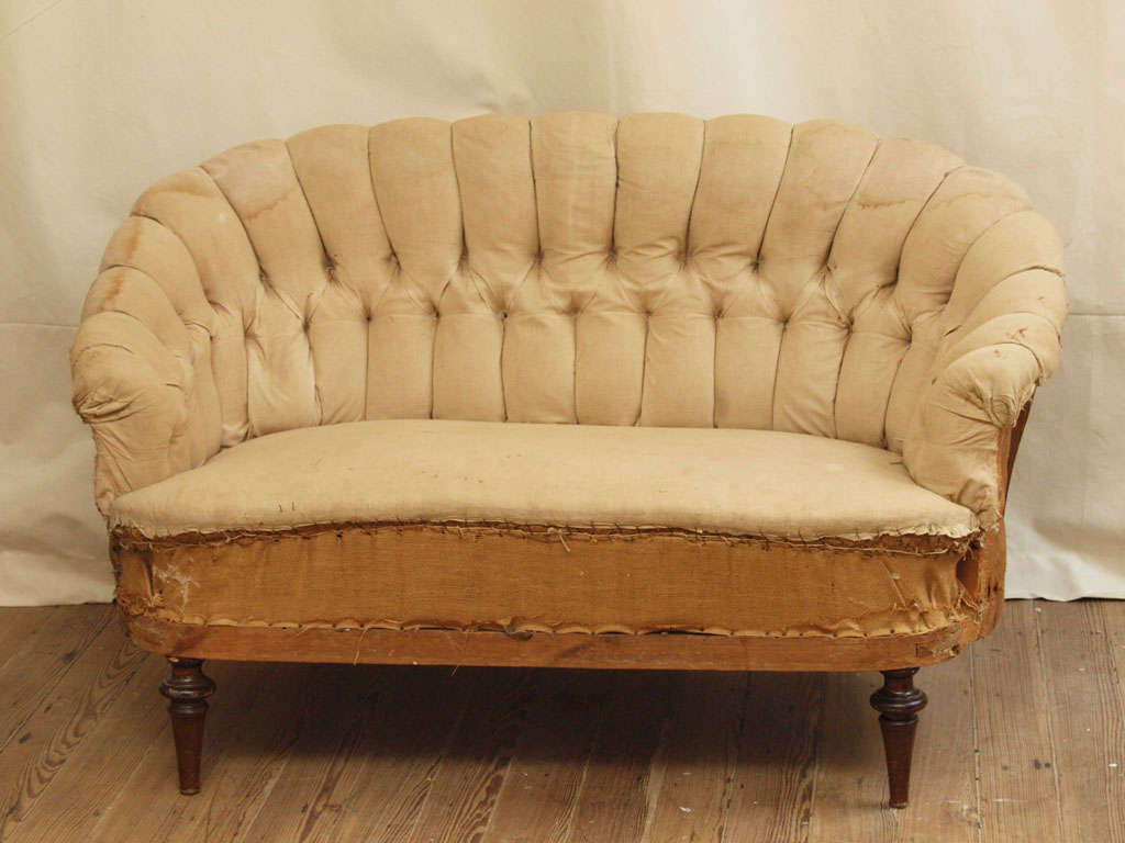 Small tufted sofa