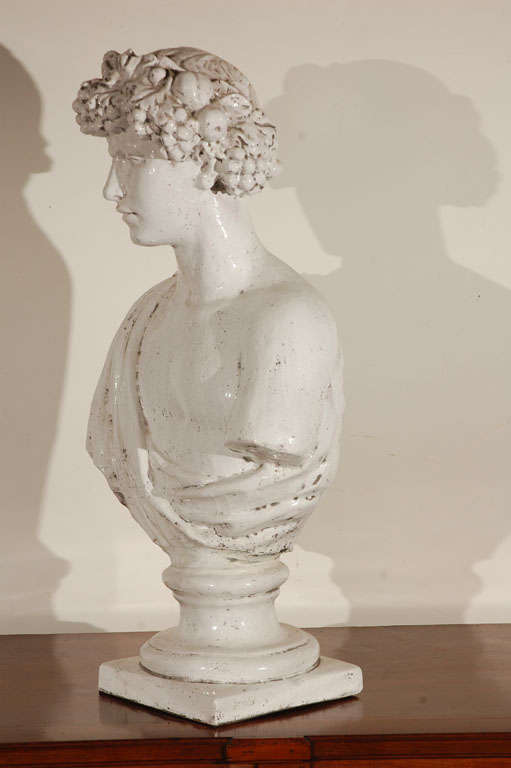 White glazed, terra cotta bust representing Summer.