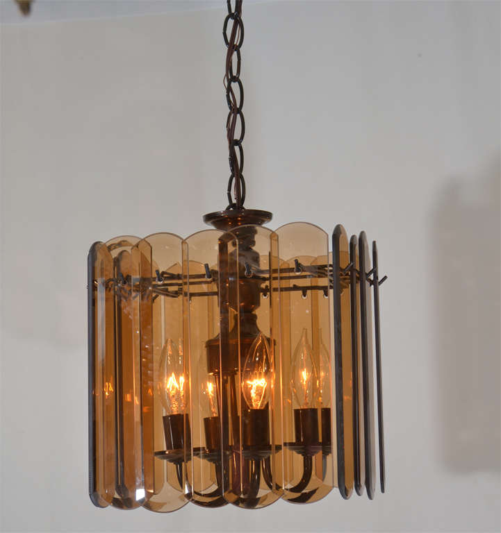 Charming, Square Shape, four light oil rubbed bronze fixture with Beveled Amber  Prismatic Glass.  Three fixtures available at $425. each.  Fixtures are 12