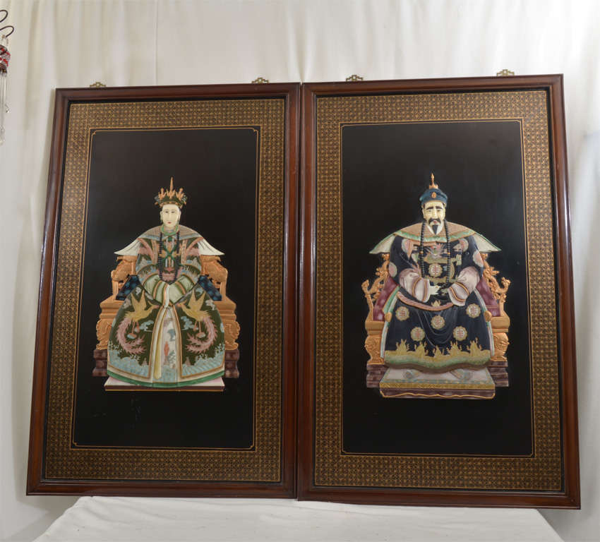 Pair of Framed Chinese Ancestral Portraits, painted on wood and inlaid with carved soapstone simulating precious materials (ivory, jade, rose quartz, etc.)