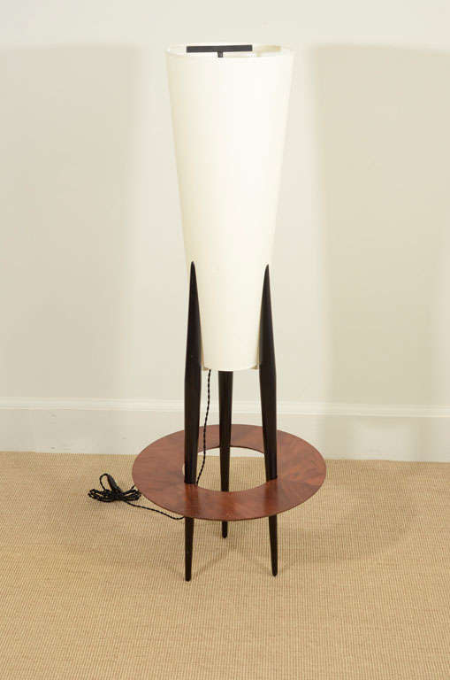 Each with a circular disc supported by three slender tapering legs, all holding a cone shaped shade.