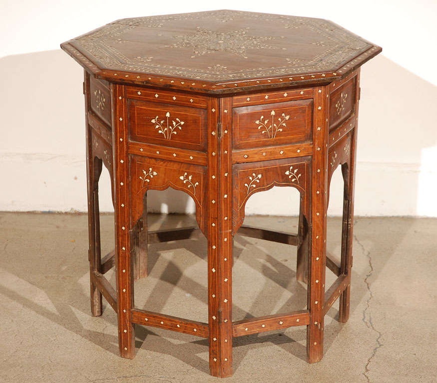 19th century Anglo Indian folding Rosewood Ivory Inlaid Octagonal Side Table.
Fine and elegant Anglo-Indian octagonal rosewood table with elaborate ivory and ebony inlay.The octagonal surface is finely carved and inlaid with ivory and ebony designs