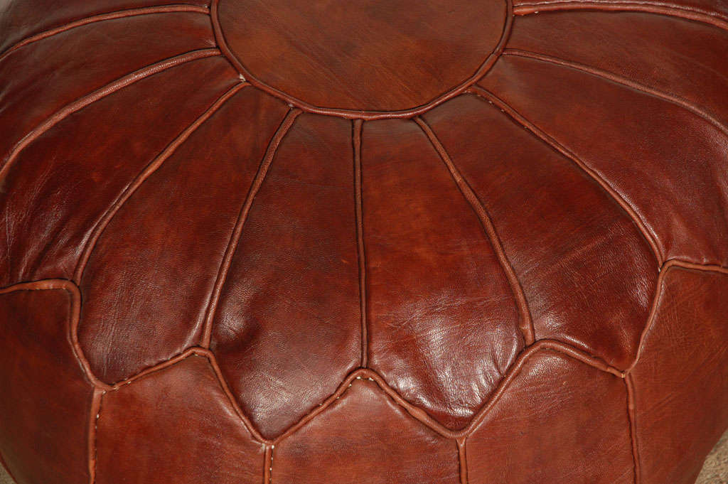 brown leather pouf