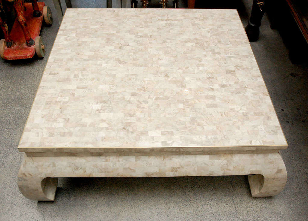 Gorgeous, Maitland-Smith square travertine veneered table
 table.
Asian style large coffee table inlaid with small rectangular pieces of veneered travertine.
Asian Style, ivory color with a brass liner around the top.
Original tag, signed and