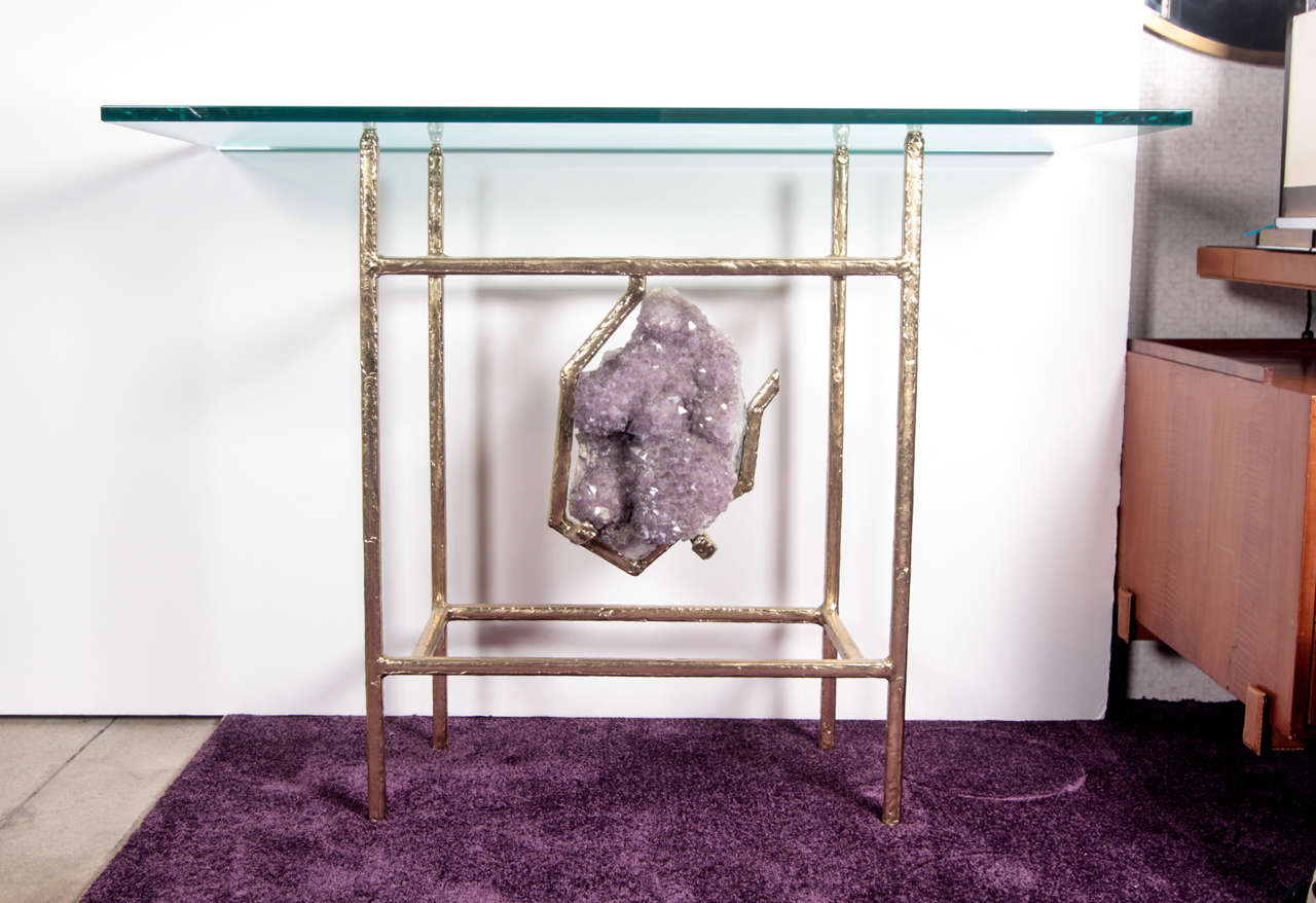 One of a kind console in Brass with an amethyst in the center