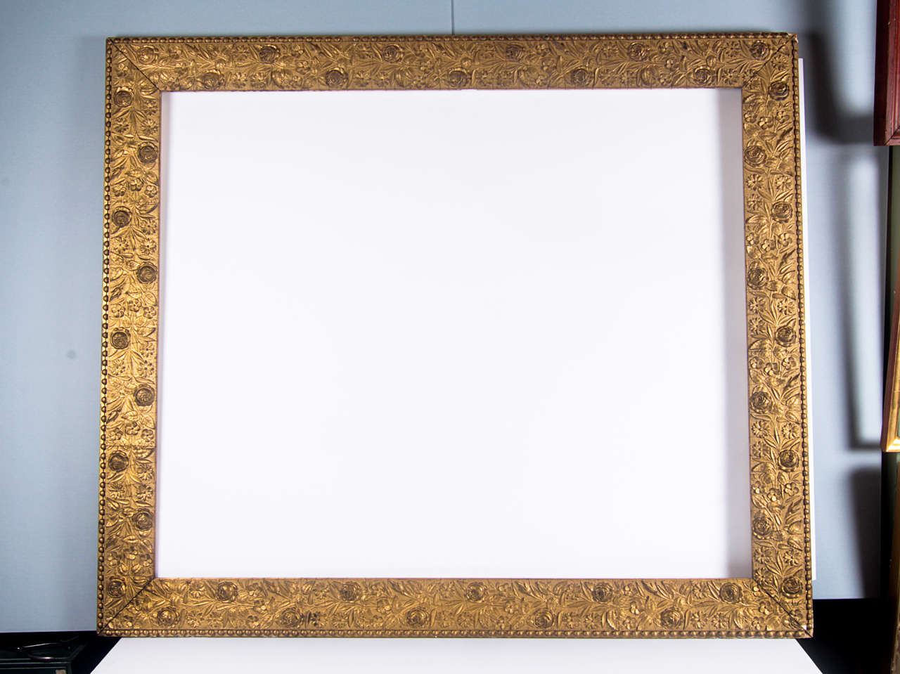 Large gilt frame with rose motif and beaded outer edge

Overall dimensions: 42 1/2 x 36 3/8 inches
Sight size: 35 3/4 x 29 1/2 inches
Moulding width: 3 1/2 inches