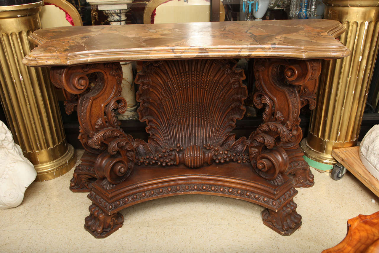 A very fine quality hand-carved Italian Rococo style faux marble top console with shell motif.
Stock number: F23.