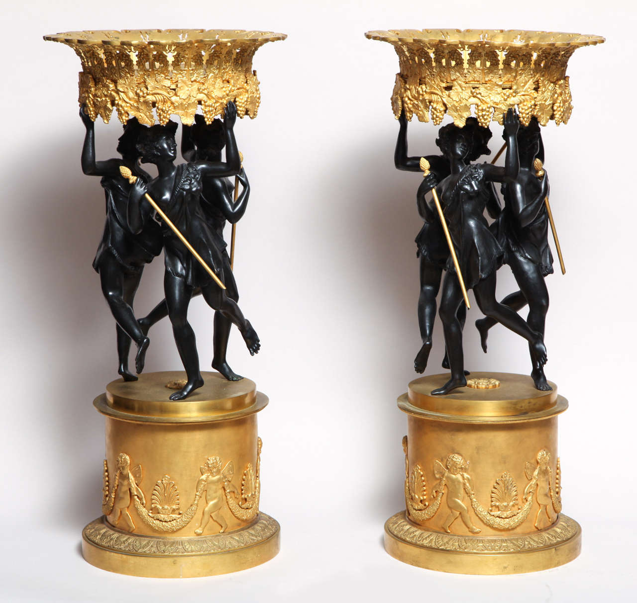 Pair of French neoclassical patinated and gilt bronze figural centerpieces.
Stock Number: DA6