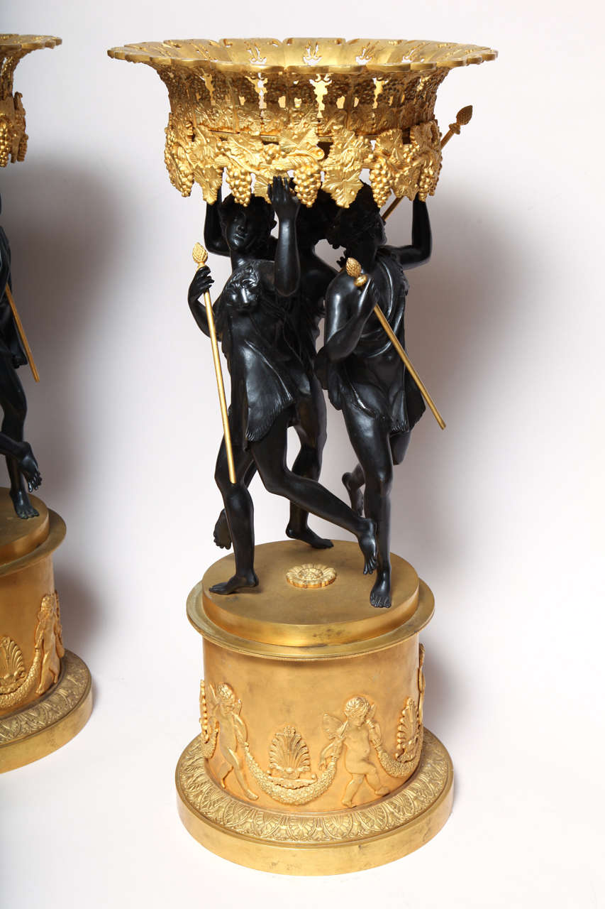 20th Century Pair of French neoclassical patinated and gilt bronze figural centerpieces
