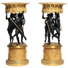 Pair of French neoclassical patinated and gilt bronze figural centerpieces
