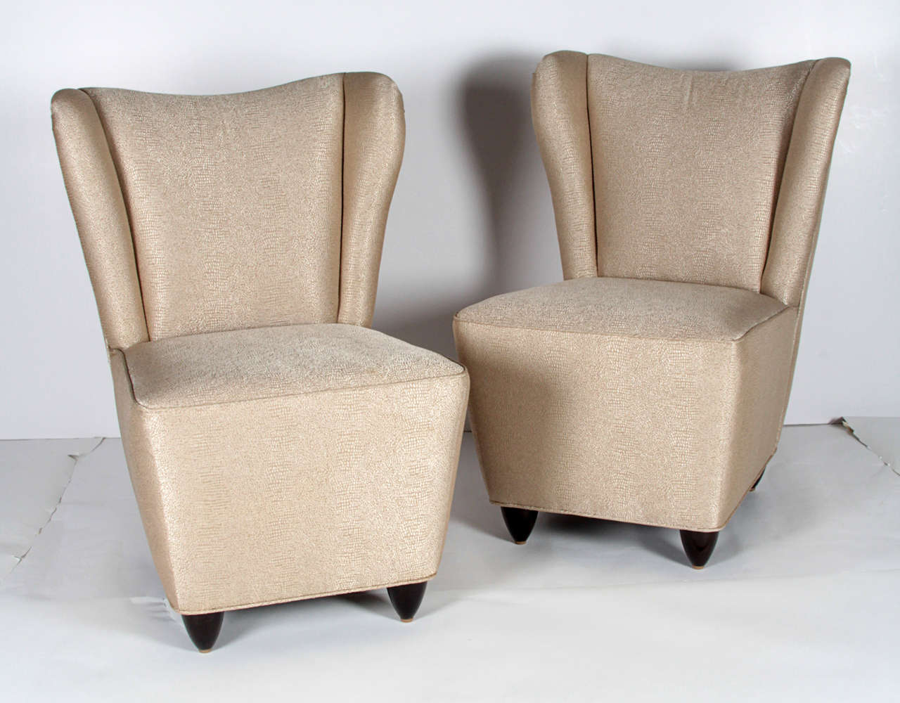 Pair of Italian wingback slipper chairs attributed to Gio Ponti.