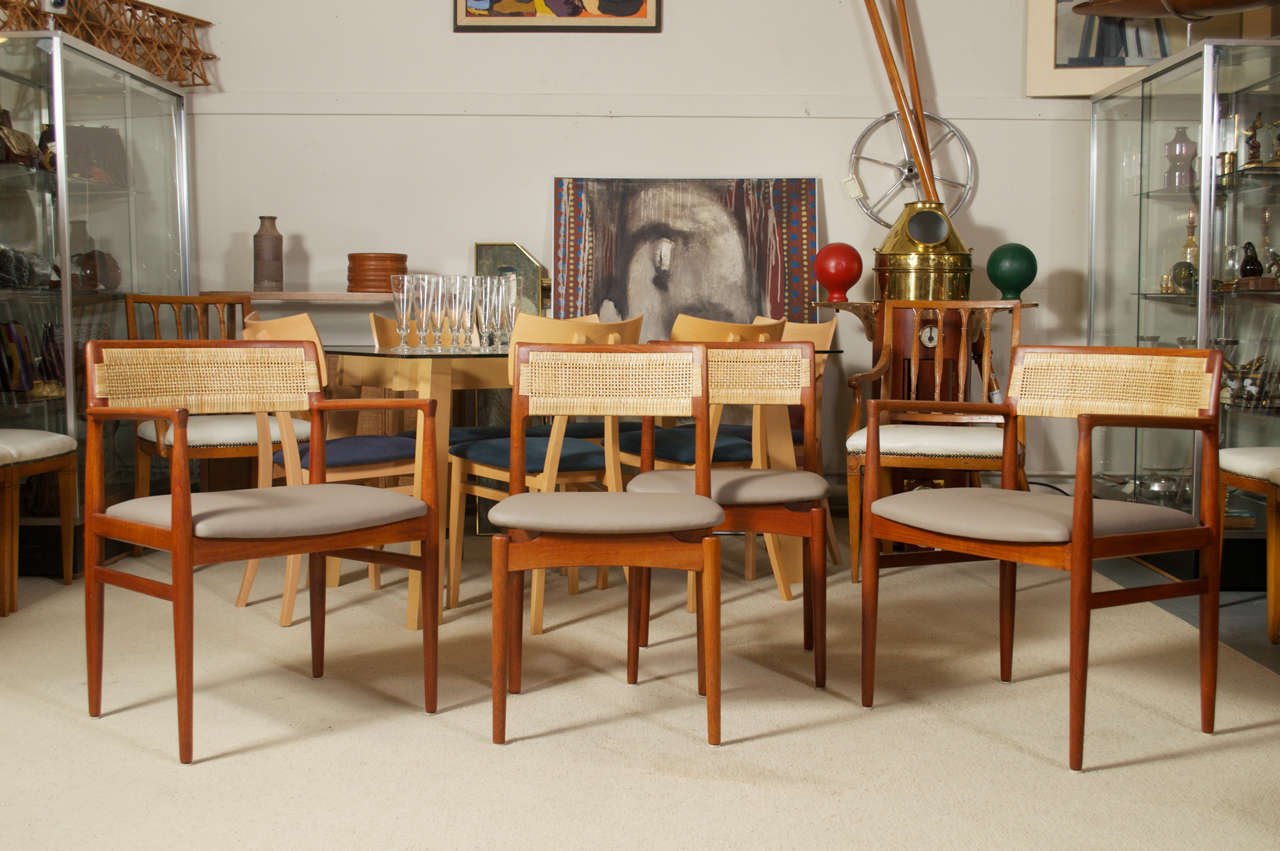 For your consideration is this scarce set of 4 Danish Modern dining chairs designed by Erik Worts for Henrik Worts Mobelsnedkeri, circa 1956.  The group consists of two arm chairs and two side chairs.  The sculpted chair frames are constructed of 