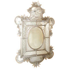 An Italian Venetian Glass Mirror with Murano Rosettes