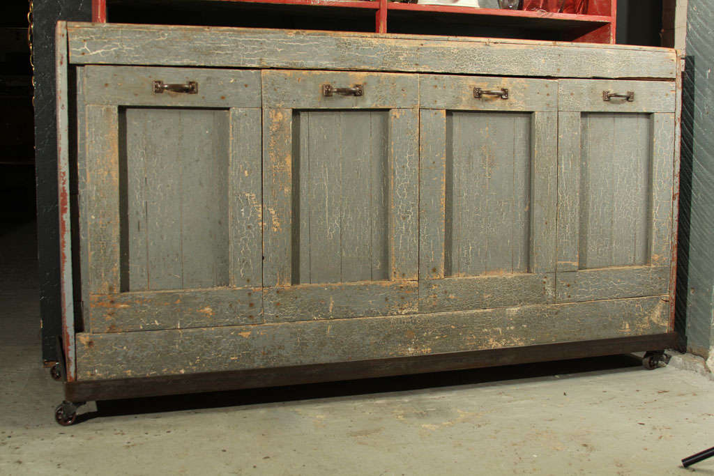 General Store Storage Bins with custom, steel, industrial base.  Casters added for easy mobility.  Original layered paint, showing crackled patina.  Great for laundry, recycling, toys...