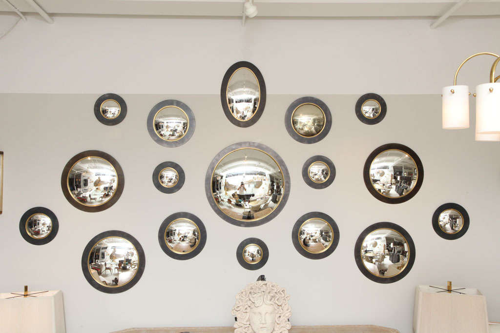 An amazing grouping of vintage convex mirrors in iron and brass - ALL varied sizes - SOLD AS GROUPING ONLY!<br />
<br />
Smallest round mirror dimensions:  9 1/2 inches diameter<br />
Largest Central mirror dimensions: 25 inches diameter<br