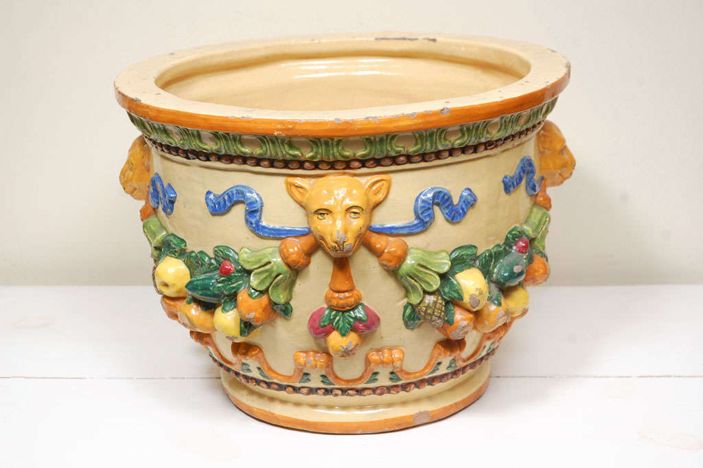 Circa 1940 Della Robbia jardinaire with animal faces, garlands and fruit. Made in Italy, glazed polychrome finish. Written 