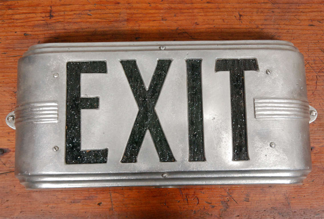 An interesting circa 1940's deco style exit sign from an old Hollywood business. It is a 