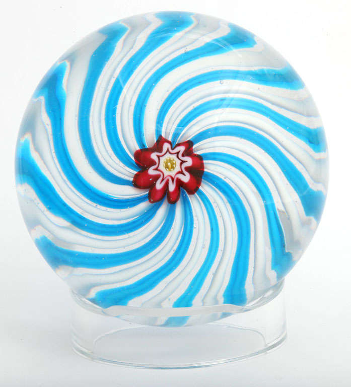 A fine antique Clichy turquoise and white swirl paperweight with a pastry mold center cane
