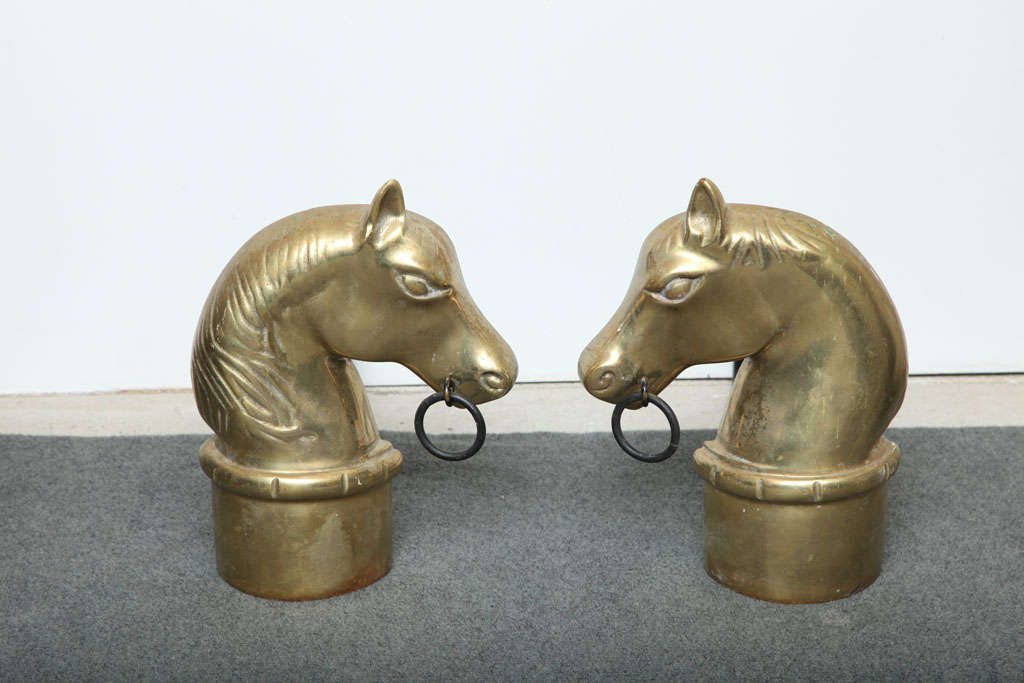 Pair of brass horse head andirons. USA, circa 1950.