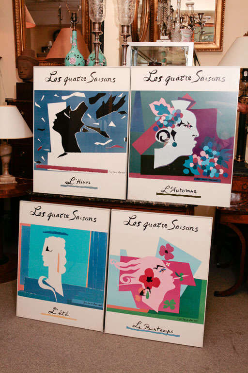 Set of four framed Yves Saint Laurent posters for the 25 years of design exhibition at the Metropolitan Museum of Art.