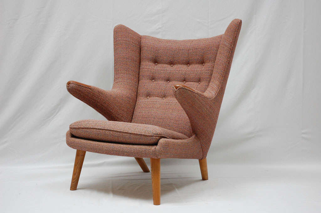 Hans Wegner papa bear chair (AP19) designed in 1950 and produced by AP Stolen. I also have some foot stools. We have another chair needing to be re-upholstered. Send us your fabric.  Store formerly known as ARTFUL DODGER INC