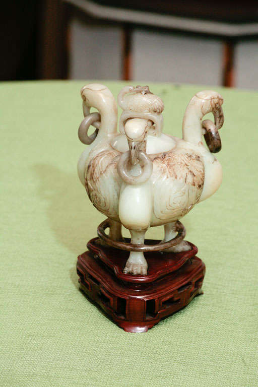 This very nicely carved covered urn in Mutton Fat jade exhibits many desirable elements. First the carving done in a beautiful late 18th century style(the golden period of jade work) associated with the rein of  Emperor Chien Lung. The loose rings