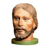Carved wood and painted head of Saint.