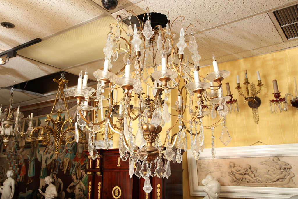 Very large Italian Venetian giltwood and crystal and rock crystal chandelier with gilt metal arms.
Stock number: L50.
