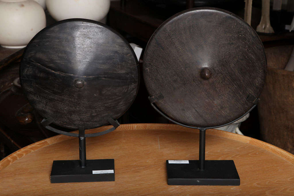 A choice of two wood spinning tops on stands, from Indonesia.  Sold separately. Identical diameters. Height of tallest on stand shown below.