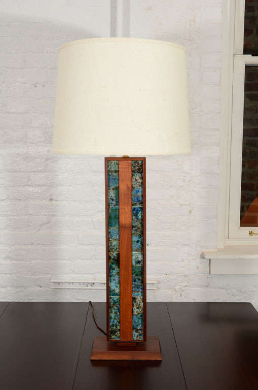 Solid walnut table lamp with inset ceramic tiles with burlap shade.